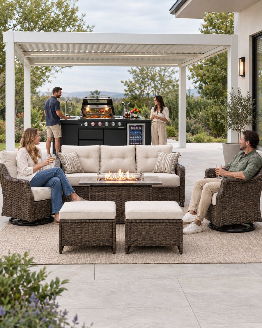 A wide view of a modern hardscaped patio terrace featuring a louvered aluminum pergola with adjustable roof
